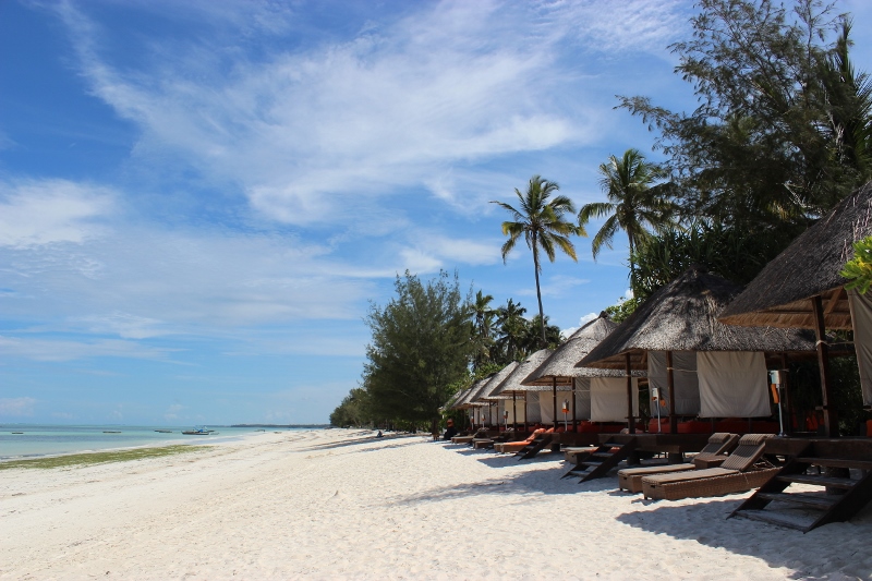 Gabi Beach with a row of private sun loungers under shade