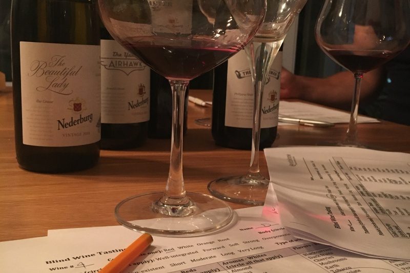Table of bottles and wine tasting notes