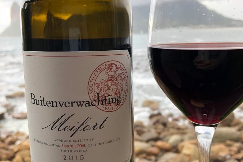 A view of Hout Bay through a bottle of Buitenverwachting Meifort wine