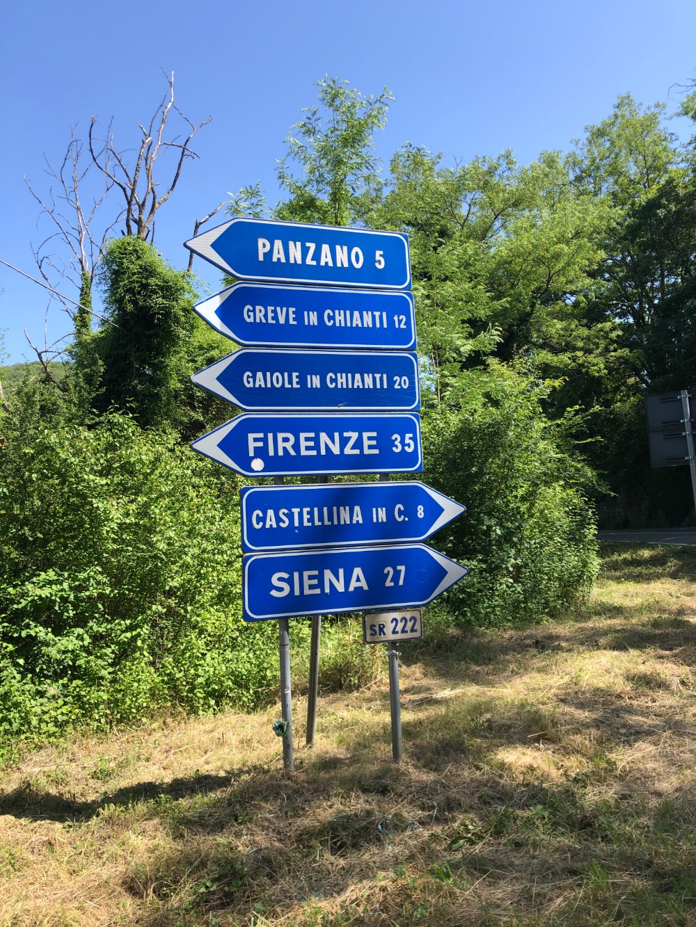 Traffic signs at the cross road while on our way to Querceto di Castellina in Tuscany in Italy