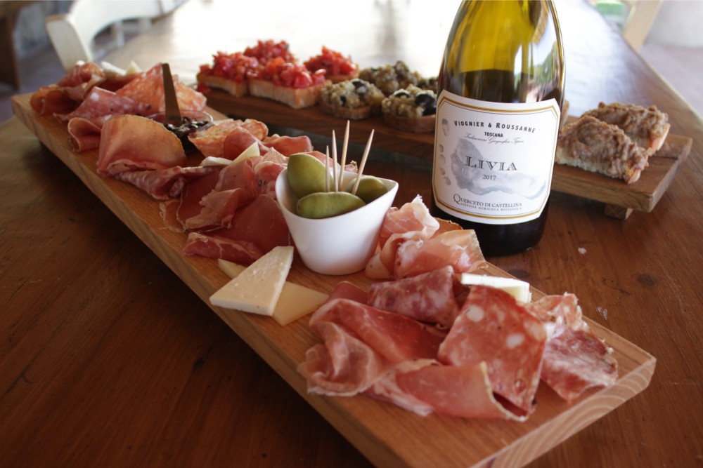 A delicious platter of cured meats paired with a stunning white wine